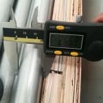 Digital caliper measuring stainless steel tube outside diameter