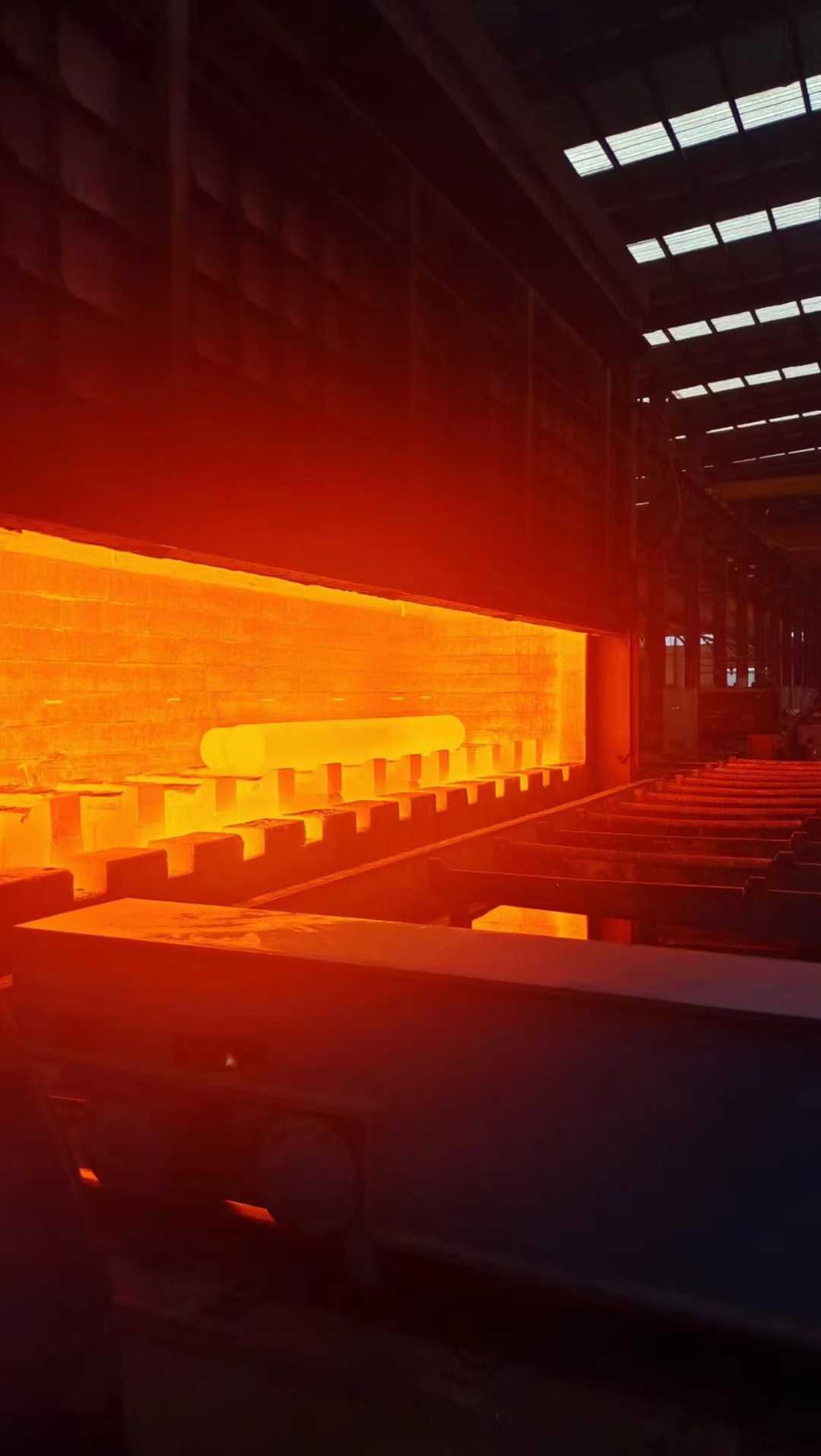 Round steel billets heated in a walking-beam furnace before piercing
