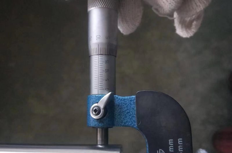 SS pipe measuring gauge in use