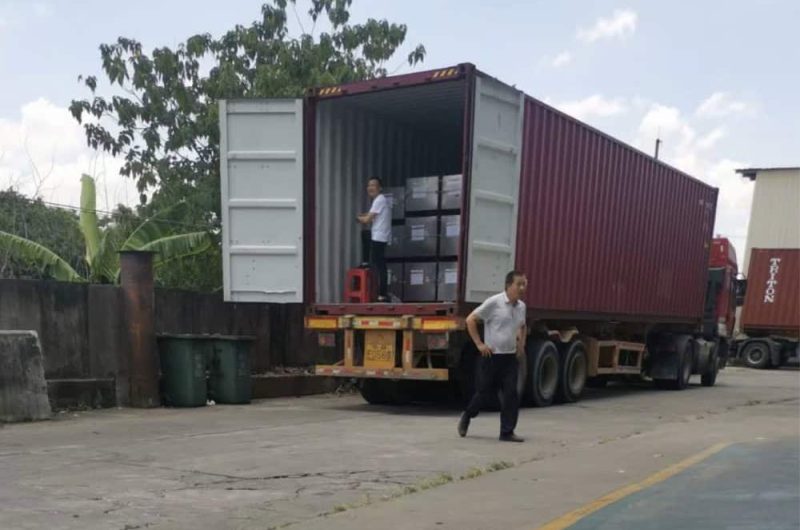 forklift loading bundled stainless pipes