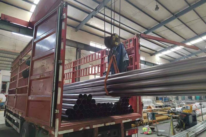 container full of stainless steel tubes
