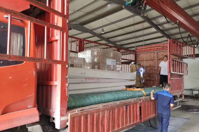 bundled stainless pipe container loading scene